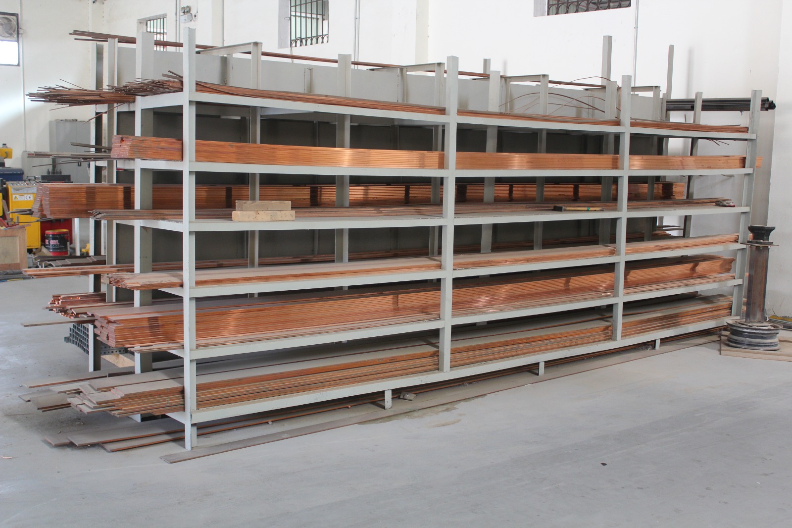 Copper busbars stored for electrical panel production